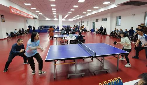 A person playing ping pong in a roomDescription automatically generated